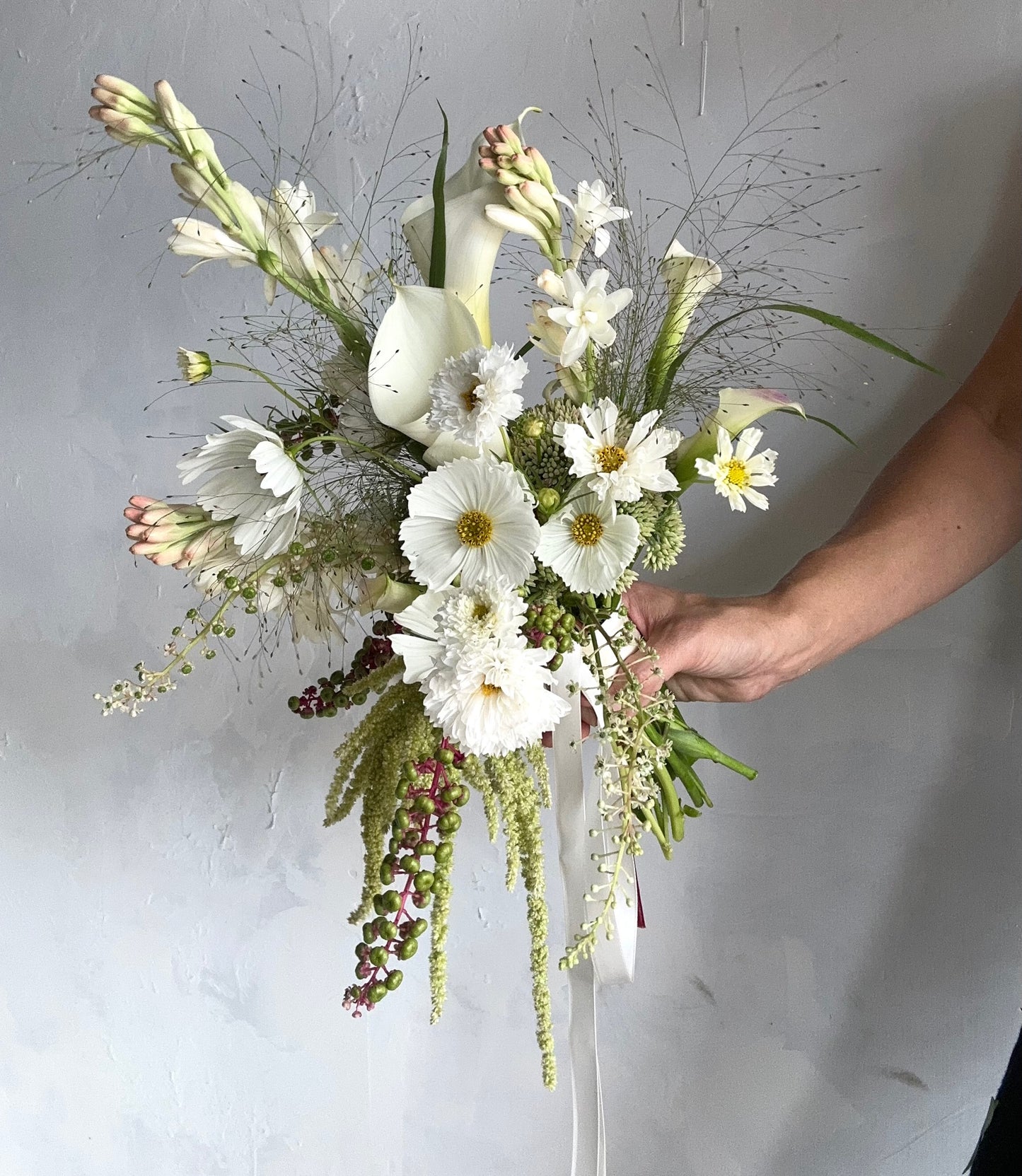 Double Tuberoses in a wedding bouquet made by one of our moms!